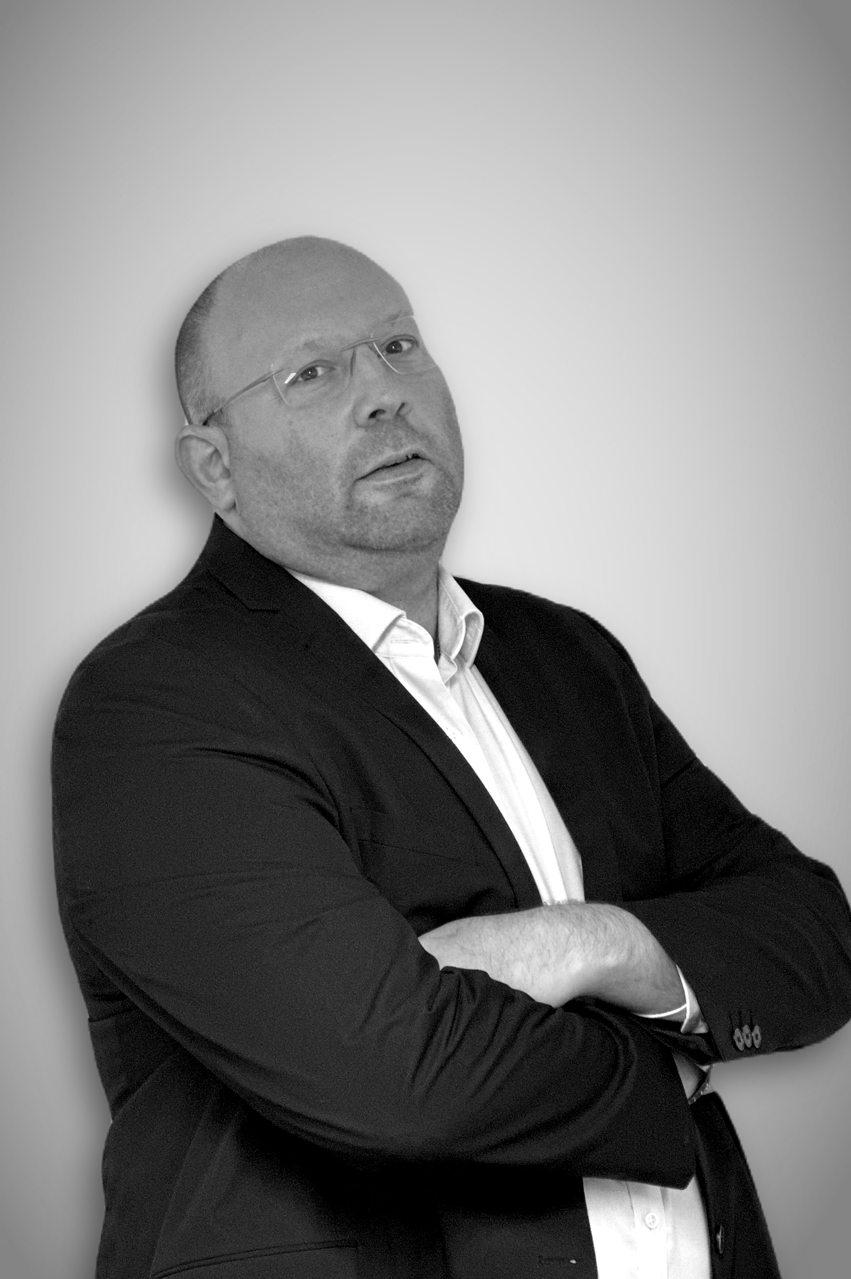 A black and white portrait image of Andrew Gutmann, Shard Capital.